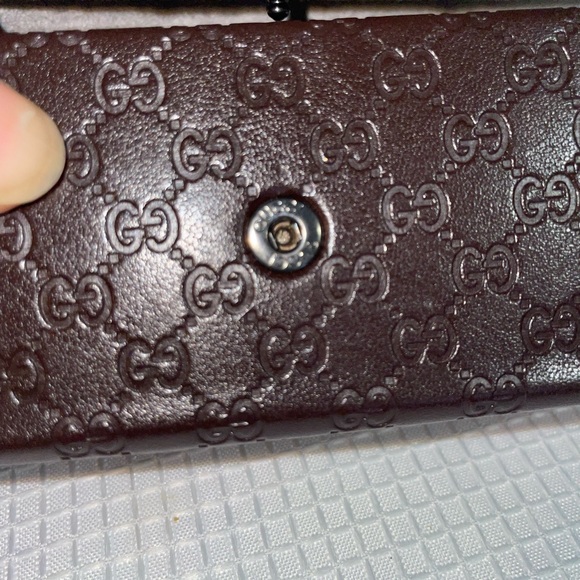 brown leather monogrammed foldable eyeglasses case from Gucci. - Picture 9 of 16